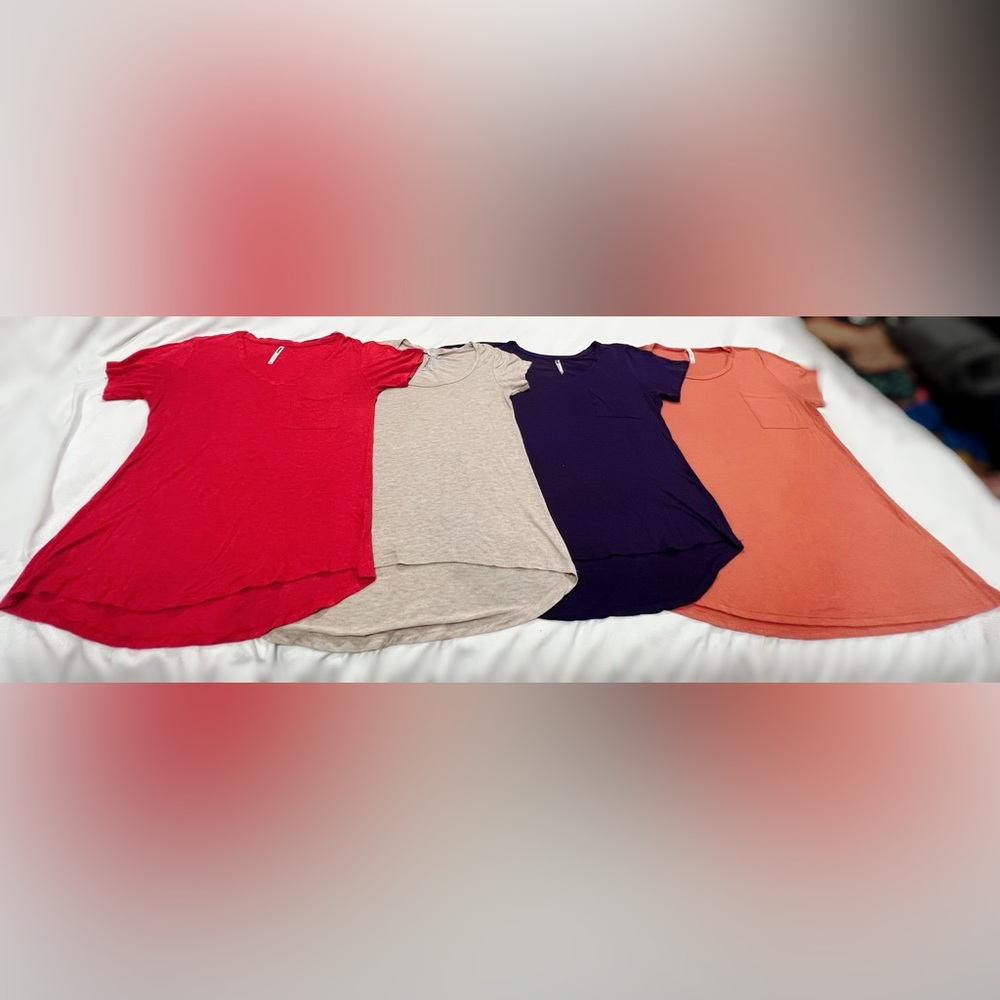 Women’s short sleeve loose fitting high low tees.  Set of 4.  Size S